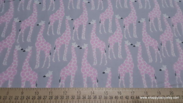 Pink Giraffes on Gray Flannel Fabric