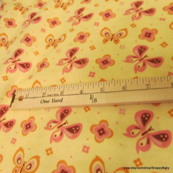 Pink Butterflies on Yellow Flannel Fabric