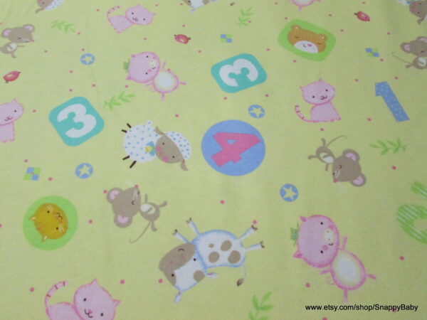 Nursery Rhymes Tossed Animals Yellow Flannel Fabric