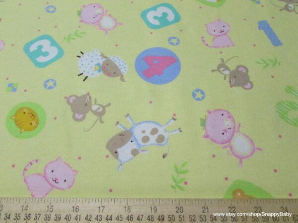 Nursery Rhymes Tossed Animals Yellow Flannel Fabric